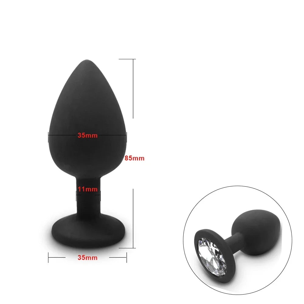 Black anal plug with measurements and a close-up of a crystal detail on a white background