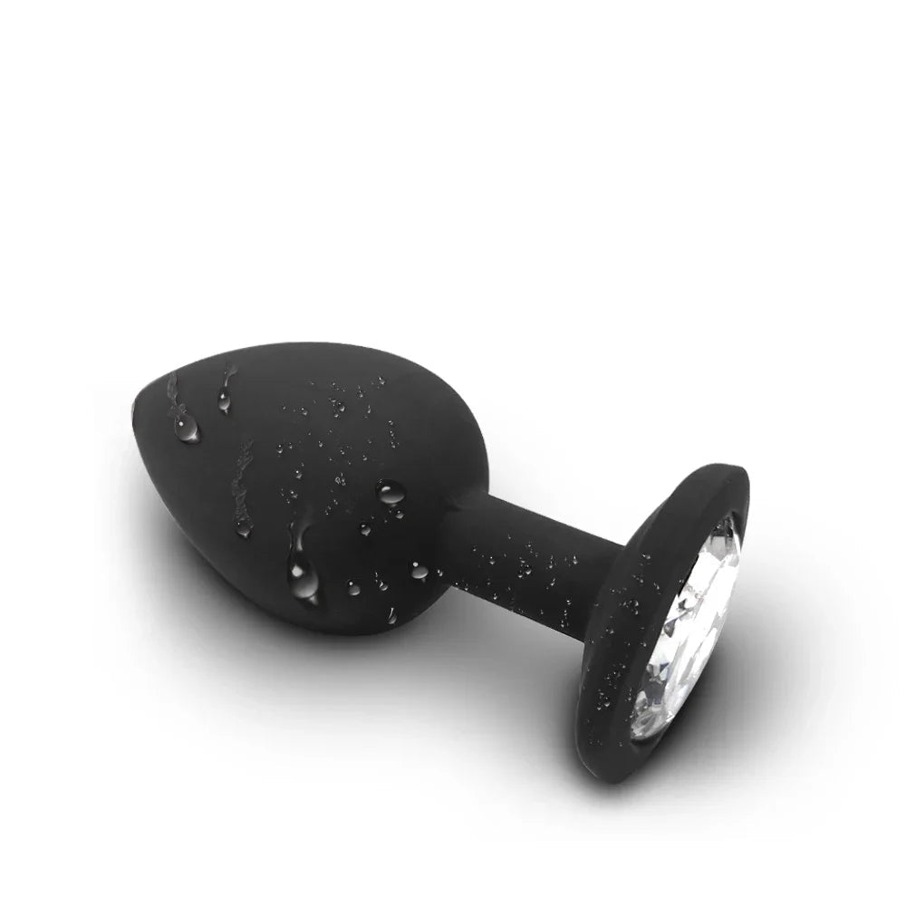 Black silicone butt plug with water droplets and a waterproof symbol on a white background
