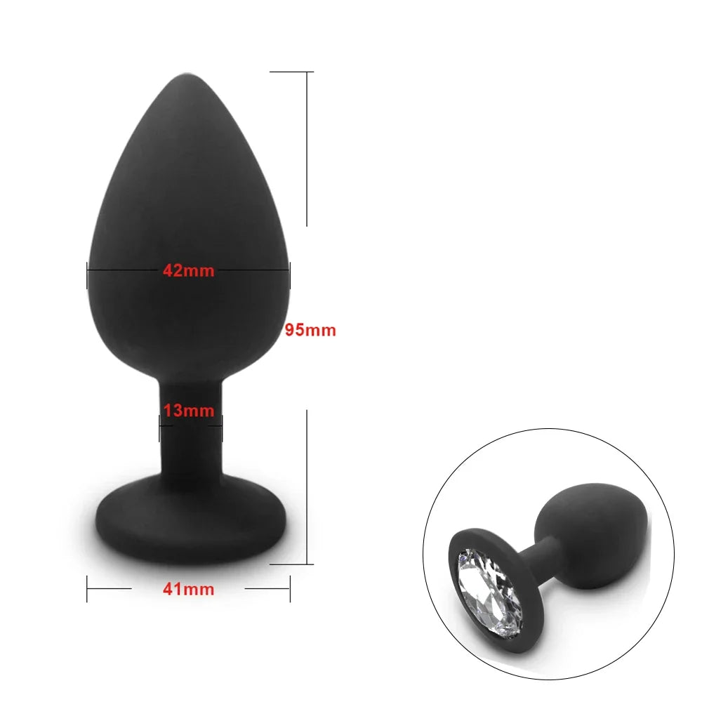 Black silicone butt plug with measurements and a close-up of a crystal detail on a white background