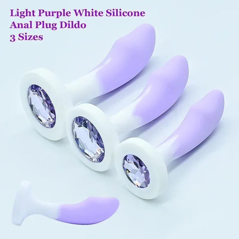 Light purple and white silicone anal plug with crystals on a light blue background