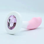 White and pink  Long Curved with a prominent gemstone on a light gray background