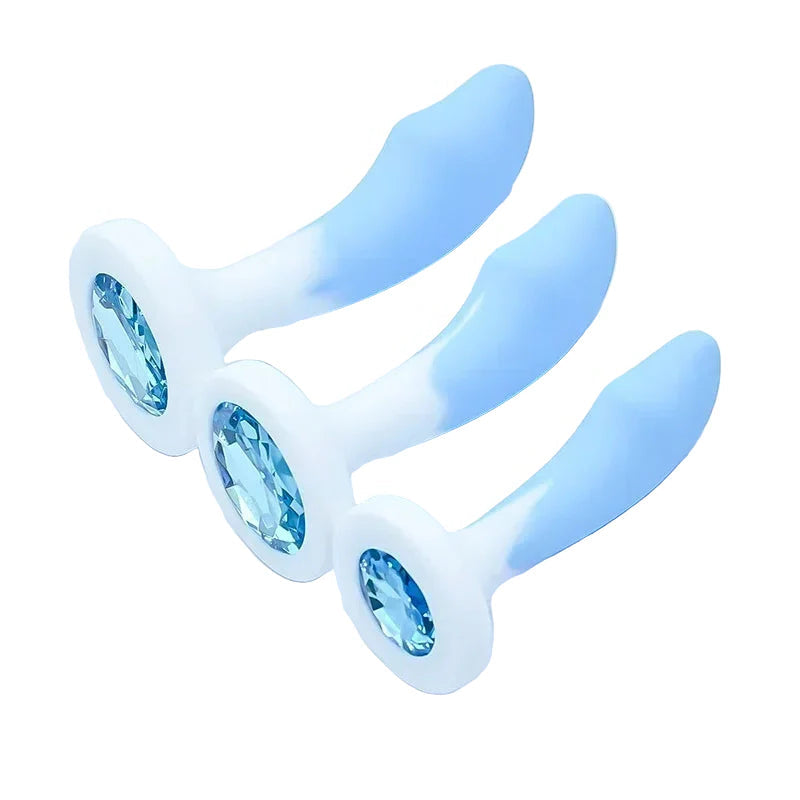 Light blue and white silicone Long Curved anal plug with text indicating sizes on a light blue background.