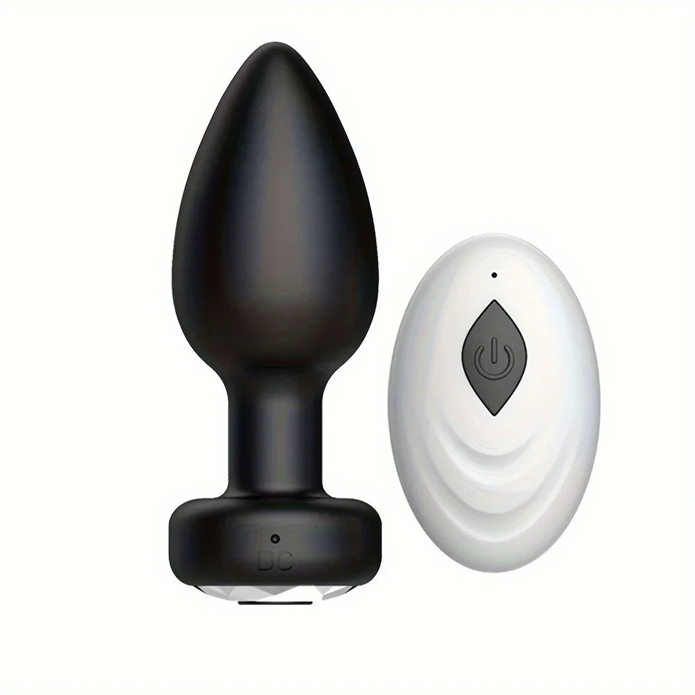 Black Wireless Anal Vibrator Butt Plug and white controller on a white background