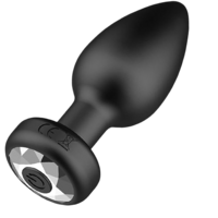 Black butt plug with LED light on a white background