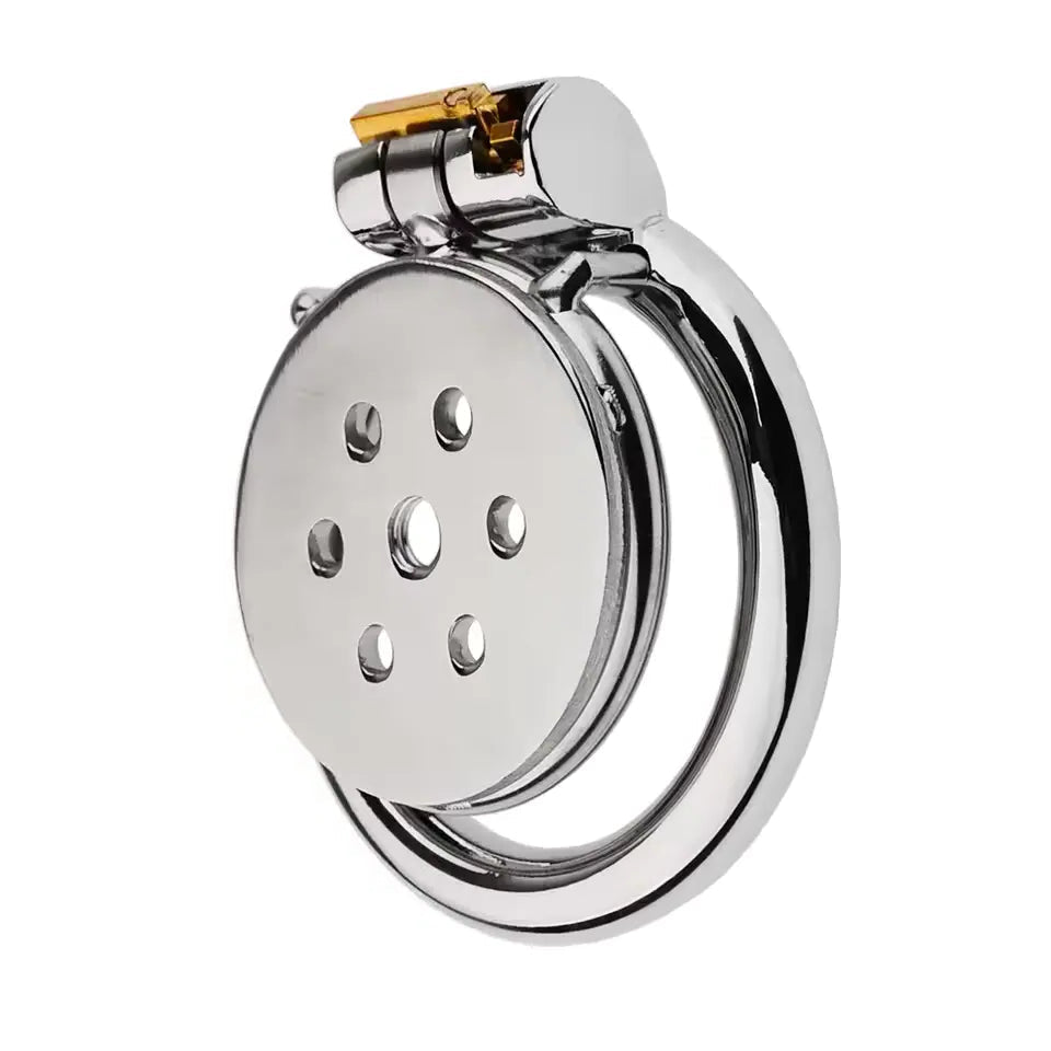 Flat metal chastity cage with a gold accent lock on a white background