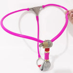 Pink female chastity belt with stainless steel plate, adjustable straps, and secure lock with keys