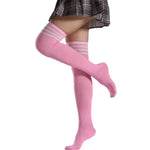 Pink knee-high socks with white stripes worn by a person on a white background