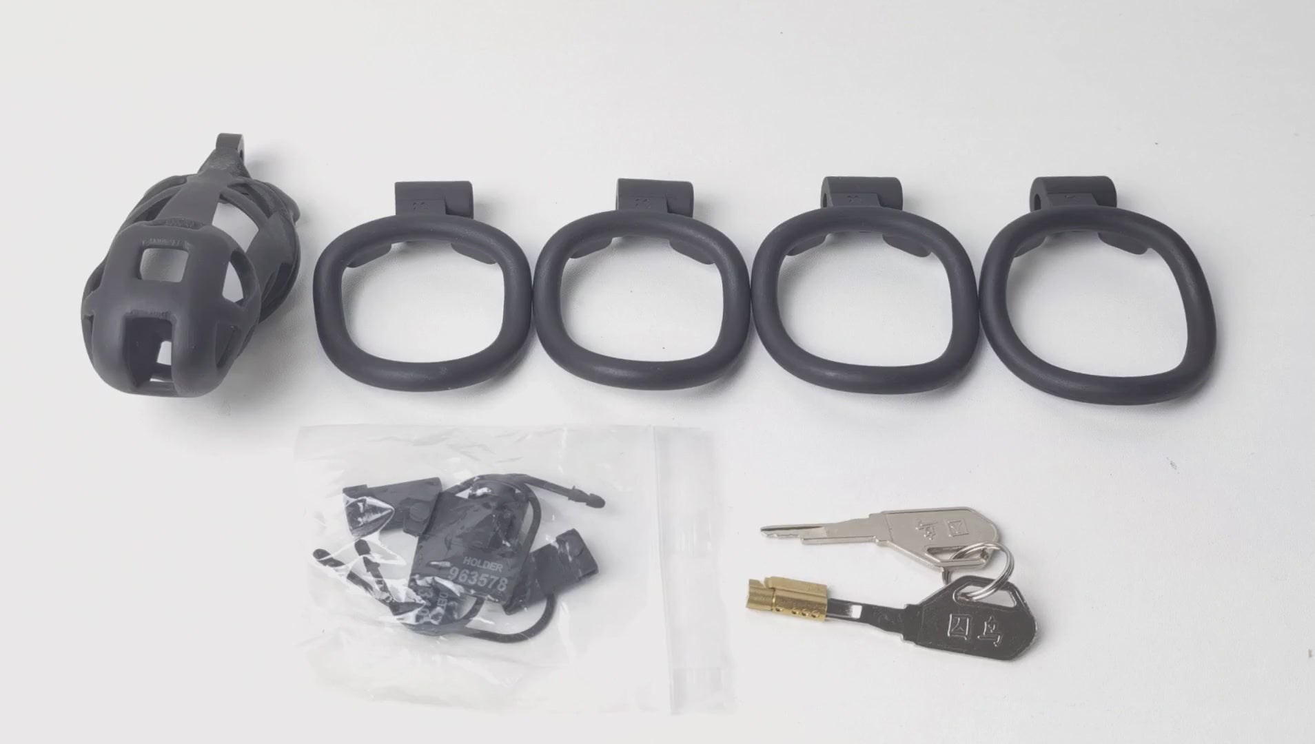 Black Cobra chastity cage unboxing and setup with rings, lock, and keys